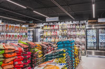 Ashario Pet Store interior displaying a wide range of pet supplies, nutritious pet food, and health and wellness products for pets.