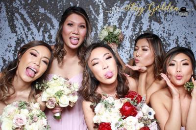 4 beautiful woman taking a pic from a photo booth